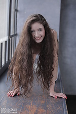 Curly brunette posing
