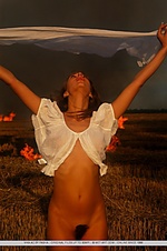Gorgeous vika ac showcasing her naked body with the burning grass and hay as her background.